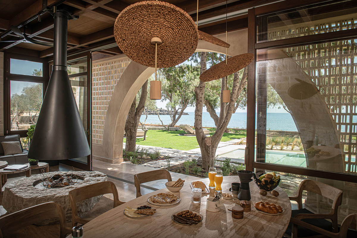 Indoor lounge with fireplace and sea view